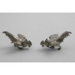 A PAIR OF VICTORIAN NOVELTY PEPPERETTES realistically cast as a pair of fighting cocks, with