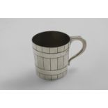 A VICTORIAN SCOTTISH MUG decorated to resemble a barrel with an angular handle, engraved with crest,