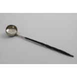 A GEORGE III SCOTTISH PUNCH LADLE with a squat circular bowl and a twisted whalebone handle,