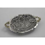 A LATE 17TH CENTURY GERMAN PARCELGILT SWEETMEAT DISH with pierced and embossed decoration,