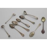 A MIXED LOT:- A George III picture-back tea spoon, a tea spoon by Hester Bateman, another by Peter &