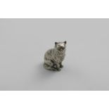 A VICTORIAN CAST NOVELTY PEPPER in the form of a cat, sitting on its haunches contentedly and