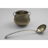 A 19TH CENTURY TWO-HANDLED CUP shaped like a cauldron, unmarked, probably South American, and a