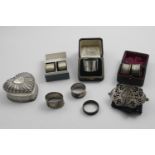 A BOXED SINGLE NAPKIN RING a boxed pair of napkin rings engraved with stars, two napkin rings in a