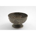 AN EDWARDIAN CIRCULAR ROSE BOWL with embossed decoration and a spreading foot, by W.H. Sparrow,