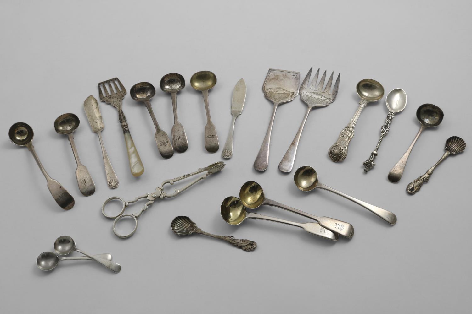 A MIXED LOT;- Fifteen various small spoons (mainly for condiments), a pair of late Victorian sugar