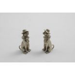 A PAIR OF VICTORIAN CAST NOVELTY FIGURAL PEPPER CASTERS each in the form of Mr Punch's dog, Toby,