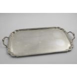 A MID 20TH CENTURY TWO-HANDLED TEA TRAY rectangular with a moulded border and shaped, incurved
