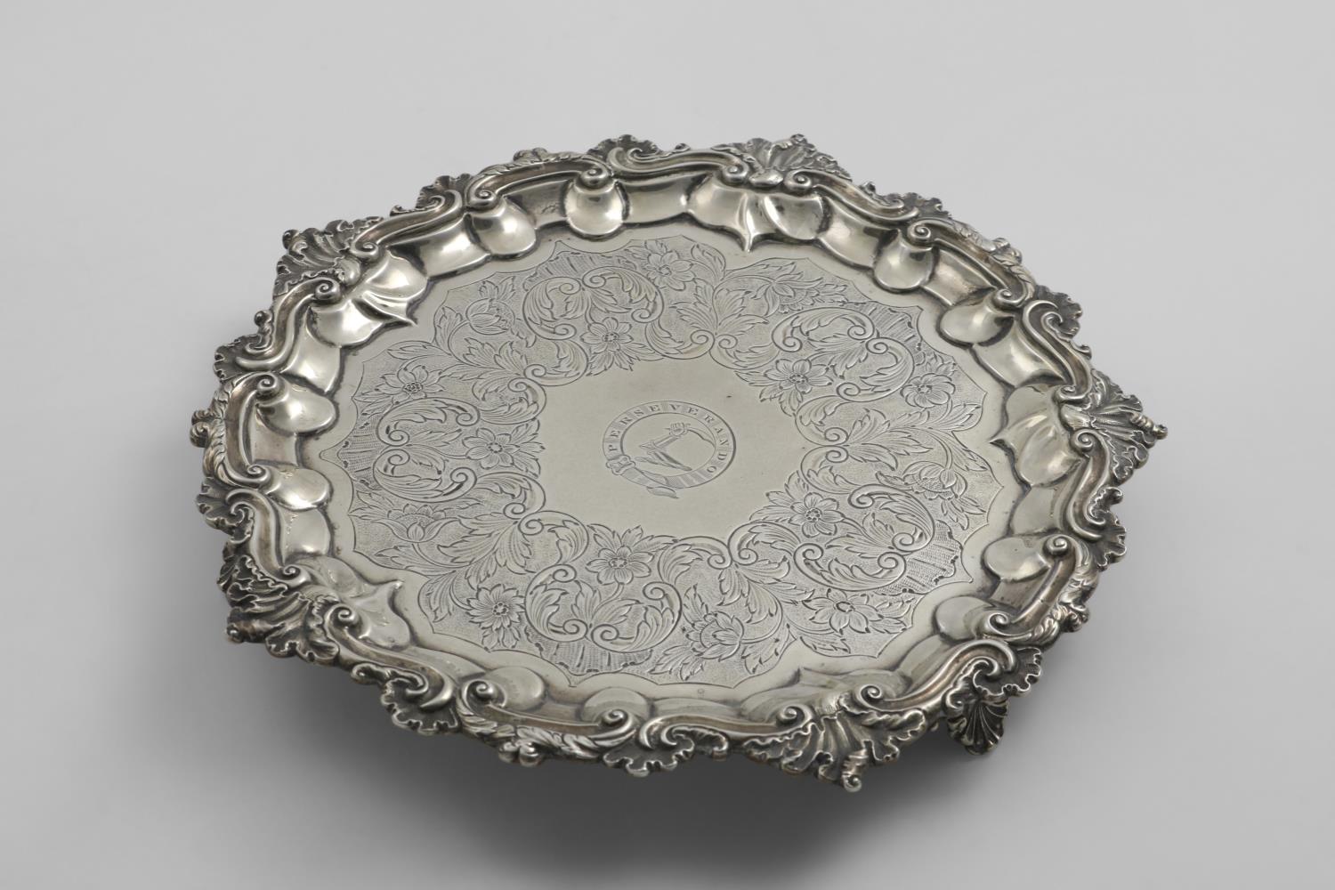 A WILLIAM IV SALVER of shaped circular outline with flat-chased decoration and a border of husks and