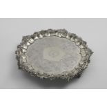 A WILLIAM IV SALVER of shaped circular outline with flat-chased decoration and a border of husks and