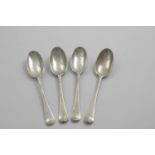 A SET OF FOUR GEORGE I DESSERT SPOONS Hanoverian pattern with plain moulded rattails, engraved on