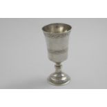 A JAMES I COMMUNION CUP OR GOBLET with flaring bowl, engraved with an upper & lower band of trailing
