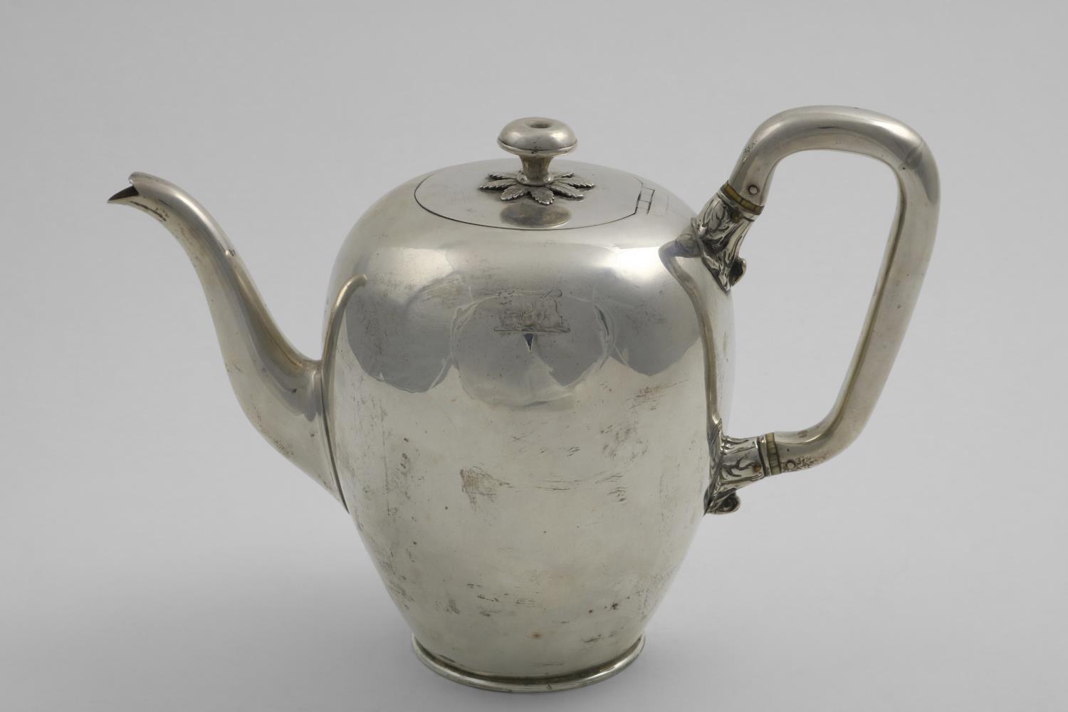 AN EARLY VICTORIAN TEA POT plain oviform with an angular handle & a knop finial, with a small