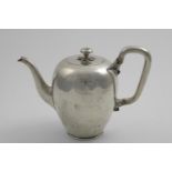AN EARLY VICTORIAN TEA POT plain oviform with an angular handle & a knop finial, with a small