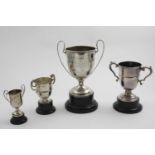 AN EDWARDIAN TWO-HANDLED TROPHY CUP "Taunton Bicycle Club...1910", & three other smaller trophy cups
