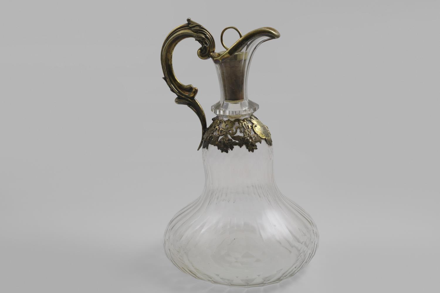 A VICTORIAN SILVERGILT MOUNTED CUT-GLASS SHIP'S DECANTER OR EWER with a mounted cork stopper, a