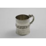 A GEORGE IV MUG with a frieze of fruiting vines around the centre of the body, engraved borders