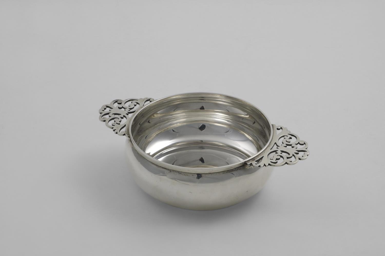 A LATE VICTORIAN SCOTTISH NUT DISH plain squat circular form with two pierced handles, initialled "