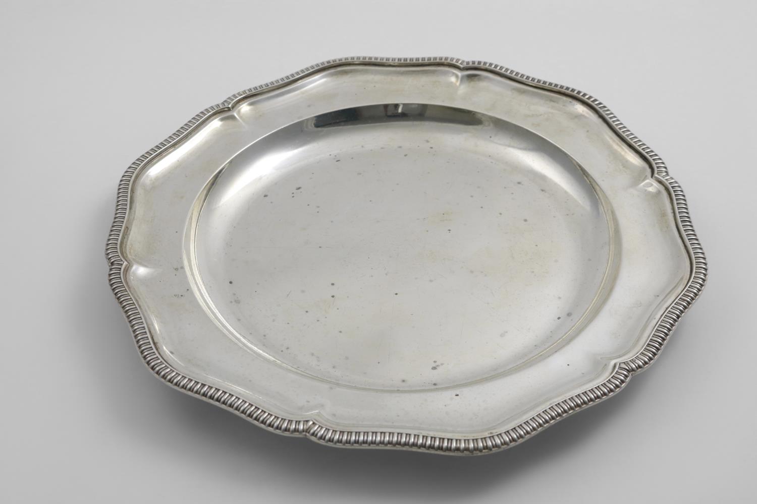 A GREAT WAR PERIOD SECOND COURSE DISH of shaped circular outline with a gadrooned border, by