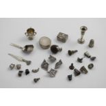 MISCELLANEOUS SMALL ITEMS:- Two small boxes, a miniature candlestick, a miniature three-handled cup,