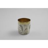 A LATE 17TH CENTURY GERMAN PARCELGILT BEAKER embossed around the sides with three classical