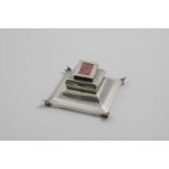 AN EDWARDIAN BEVELLED SQUARE INKWELL AND STAMP BOX COMBINED with two hinged covers, a drop-in