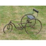 A c1910 Juvenile Tiller-Steered Tricycle. Drive operated by lever driven crank, the cast and