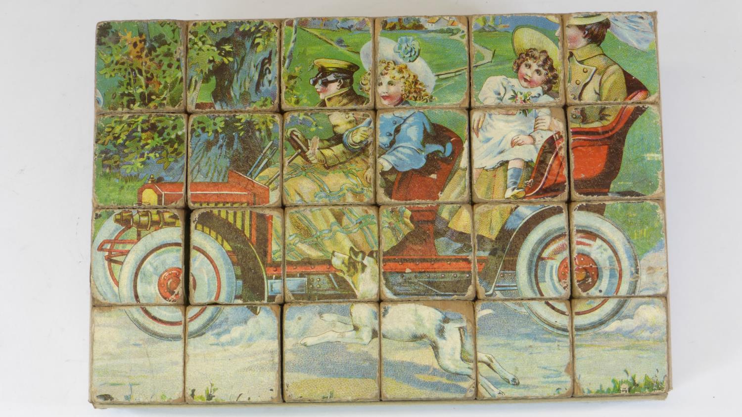 A Child's Wood-Block Puzzle. A set of 24 wooden blocks with a colour image of a motorcar and other