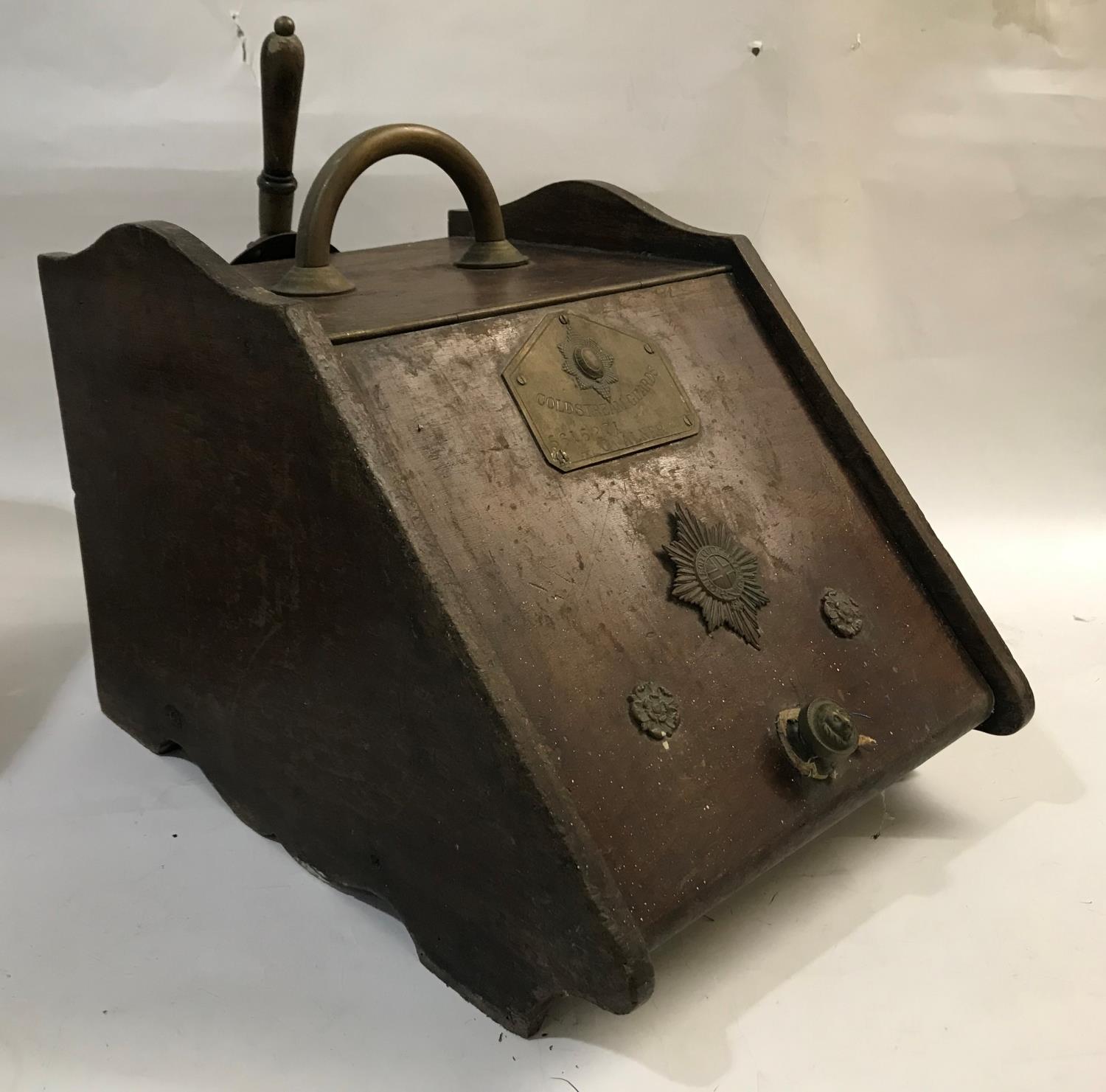 COLDSTREAM GUARDS INTEREST: A late Victorian walnut and brass mounted slope fronted coal box with