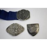 SILVER NURSES BUCKLE a shield shaped buckle with latin motto Ratione Dirice Cursom (University