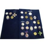 NURSING BADGES 25 various badges on two cards, including a silver and enamel badge (Finis Coronat