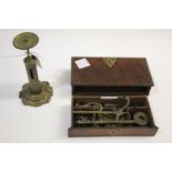 BRASS FOLDING SCALES - CASED a set of brass scales which screw into the lid, with a variety of brass