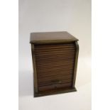 MAHOGANY BRASS BOUND CIGAR CABINET a mahogany cabinet with brass banding and a tambour front, with 5