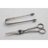 A PAIR OF GEORGE III BRIGHT-ENGRAVED SUGAR TONGS with a vacant oval cartouche, by either Thomas