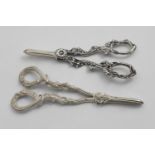 TWO PAIRS OF ELIZABETH II GRAPE SHEARS the longest pair 6;.9" (17.5 cms) long; 7.8 oz (2)