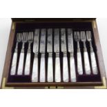 AN EDWARDIAN CASED SET OF TWELVE PAIRS OF ENGRAVED FRUIT/DESSERT KNIVES & FORKS with mother -of-