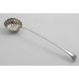 A GEORGE II / III SOUP LADLE with a rudimentary Onslow or scroll germinal and a fluted circular