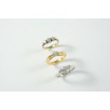 A DIAMOND SOLITAIRE RING set with a circular-cut diamond in yellow gold, size L 1/2, together with a