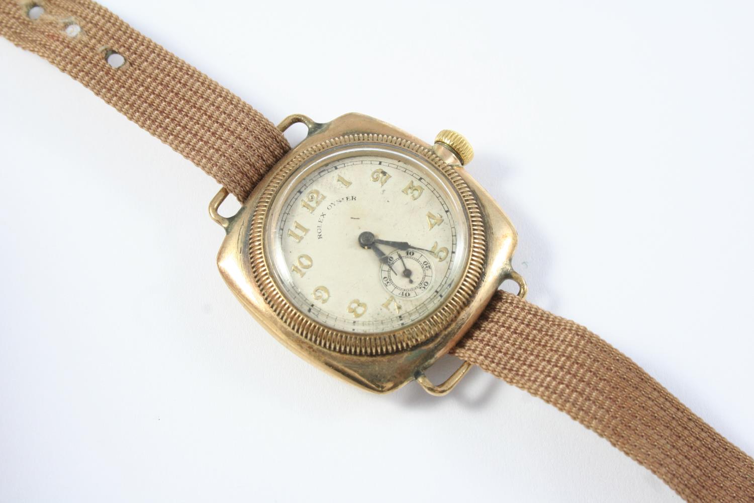 A VINTAGE GOLD OYSTER WRISTWATCH BY ROLEX the circular dial in a cushion shaped case, with Arabic