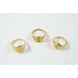AN 18CT GOLD SIGNET RING engraved with a crest, 5.7 grams, size G , together with another 18ct