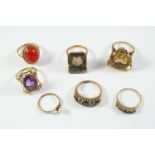 SEVEN ASSORTED GOLD AND GEM SET RINGS