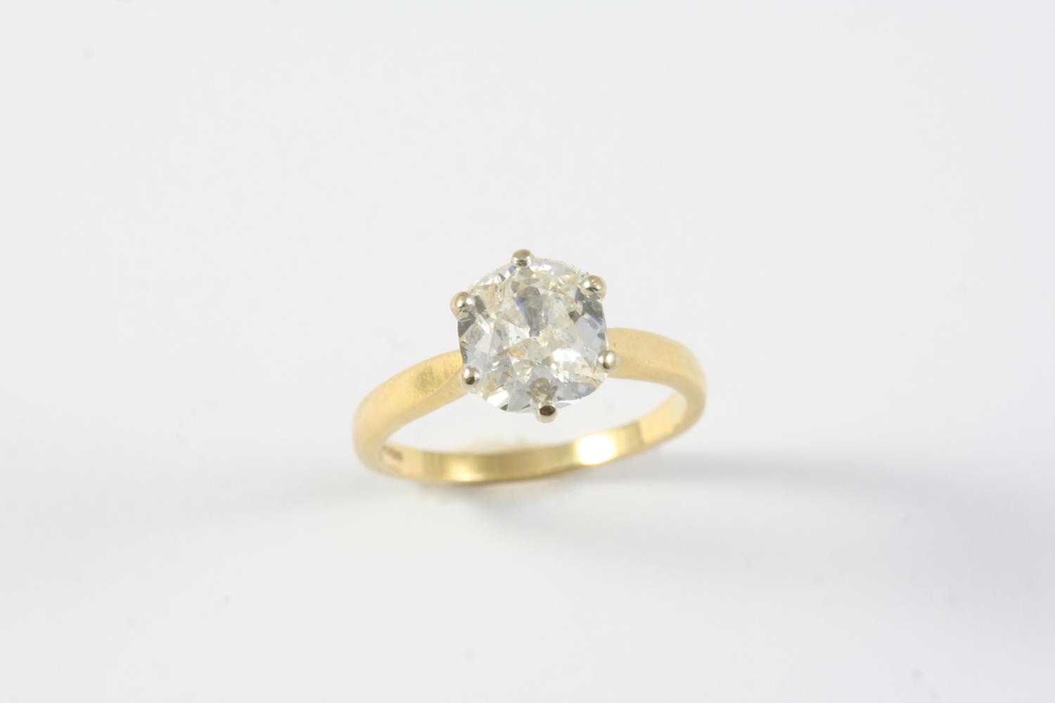 A DIAMOND SOLITAIRE RING the cushion-shaped old-cut diamond weighs approximately 2.20 carats and