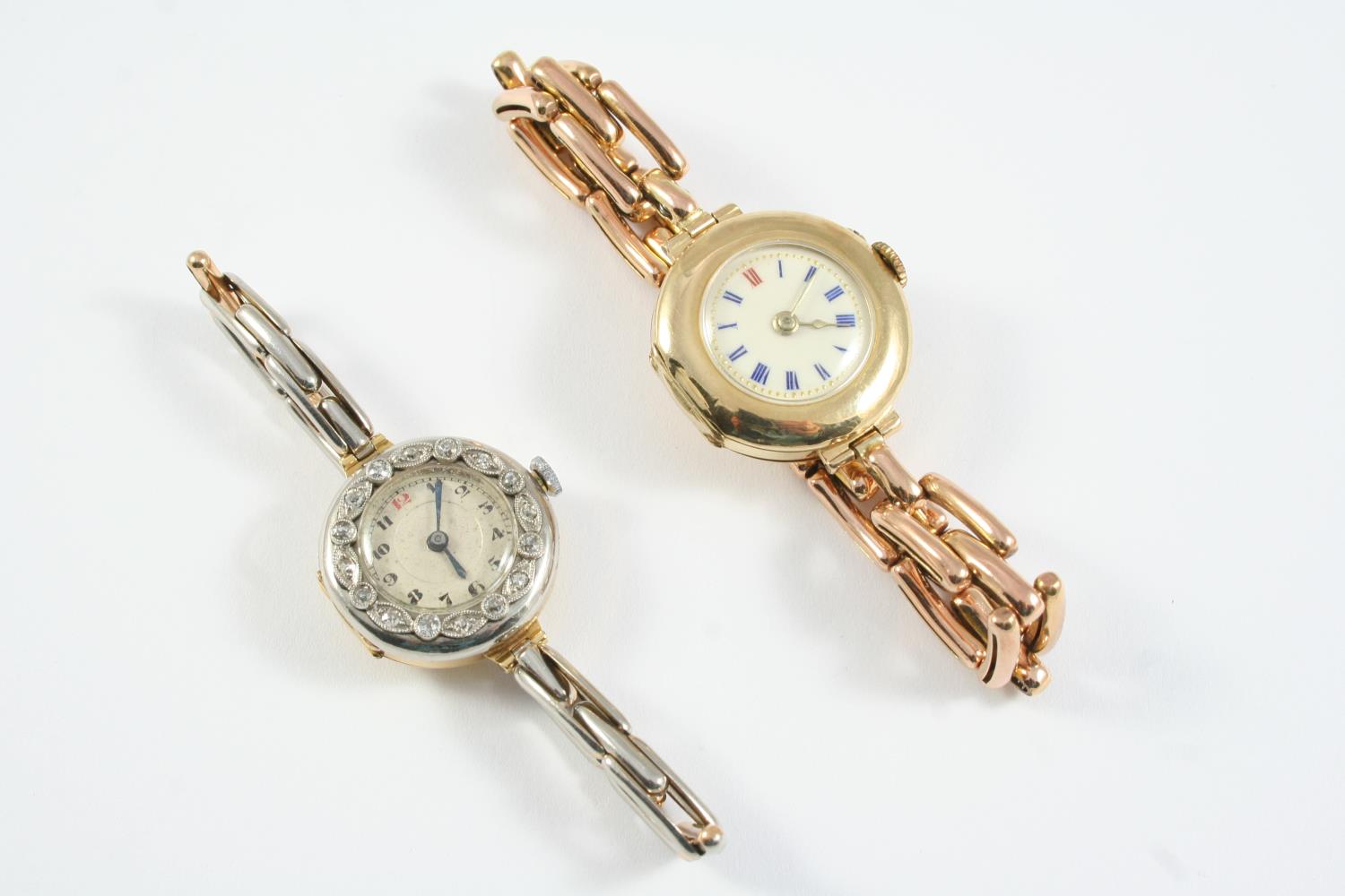 A LADY'S DIAMOND AND GOLD WRISTWATCH the circular dial with black Arabic numerals, one red Arabic