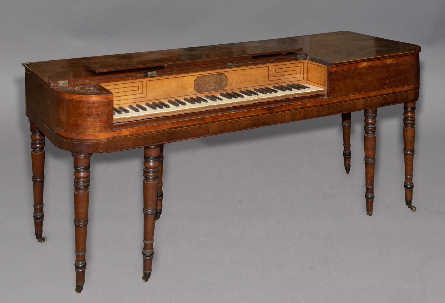 A VICTORIAN SQUARE PIANO. The piano with five and a half octaves, the strings struck by felt covered