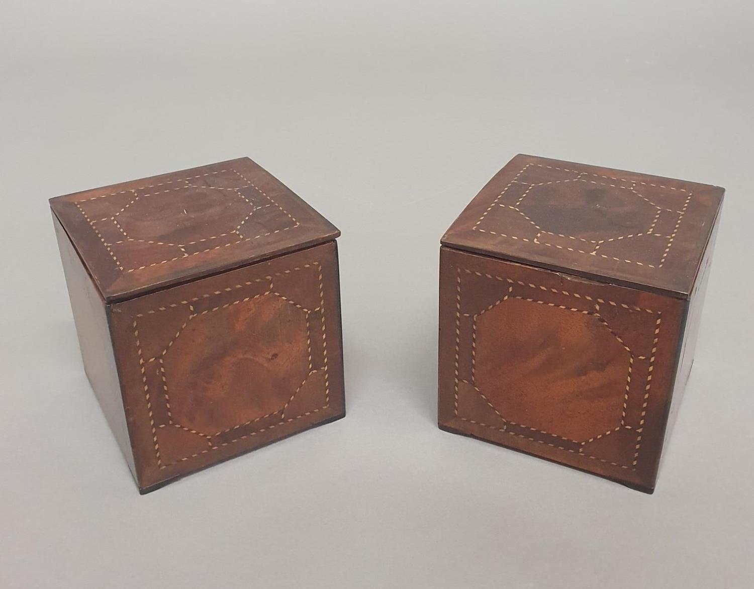 A PAIR OF GEORGE III MAHOGANY TEA CADDIES. A pair of George III tea canisters of cube form, veneered