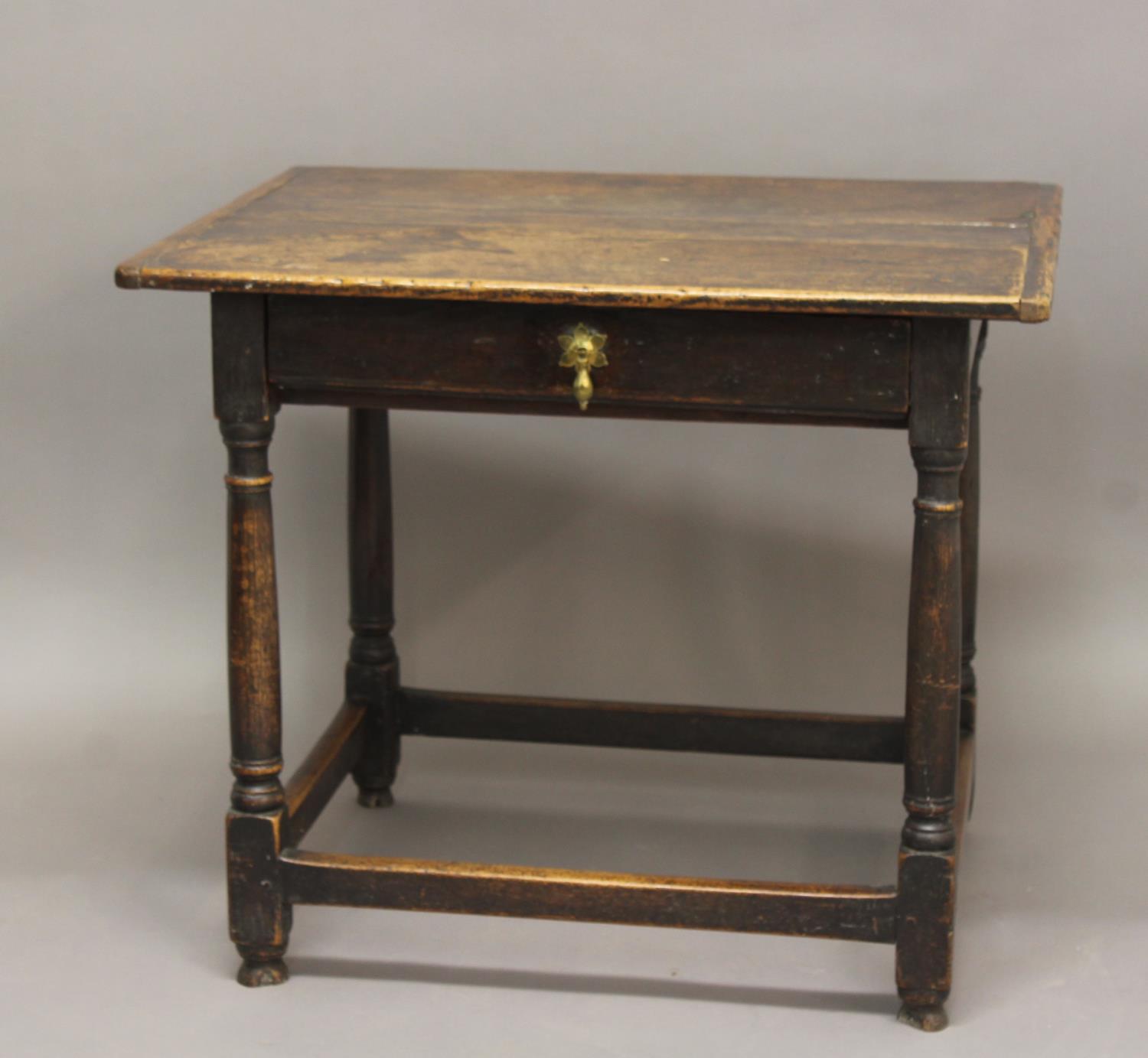 A LATE 17TH CENTURY OAK SIDE TABLE. A rectangular topped side table with broad top above a single