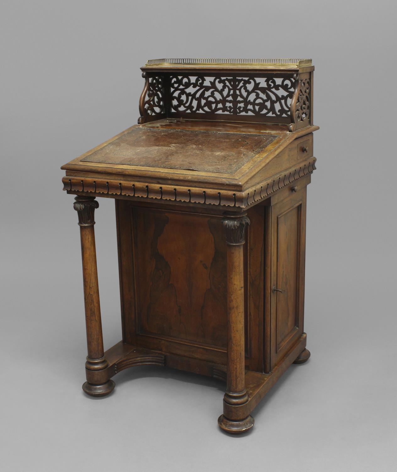 A VICTORIAN ROSEWOOD DAVENPORT, the brass-galleried top above pierced foliate superstructure and a