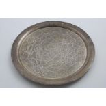 A 20TH CENTURY EGYPTIAN CIRCULAR SALVER OR TRAY profusely decorated with engraving and flat-chasing;