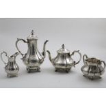 A VICTORIAN ENGRAVED FOUR-PIECE TEA & COFFEE SERVICE with fluted baluster bodies, scroll feet and