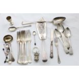 A MIXED LOT:- A George III basting spoon, eight various table forks, a Fiddle pattern fish slice and